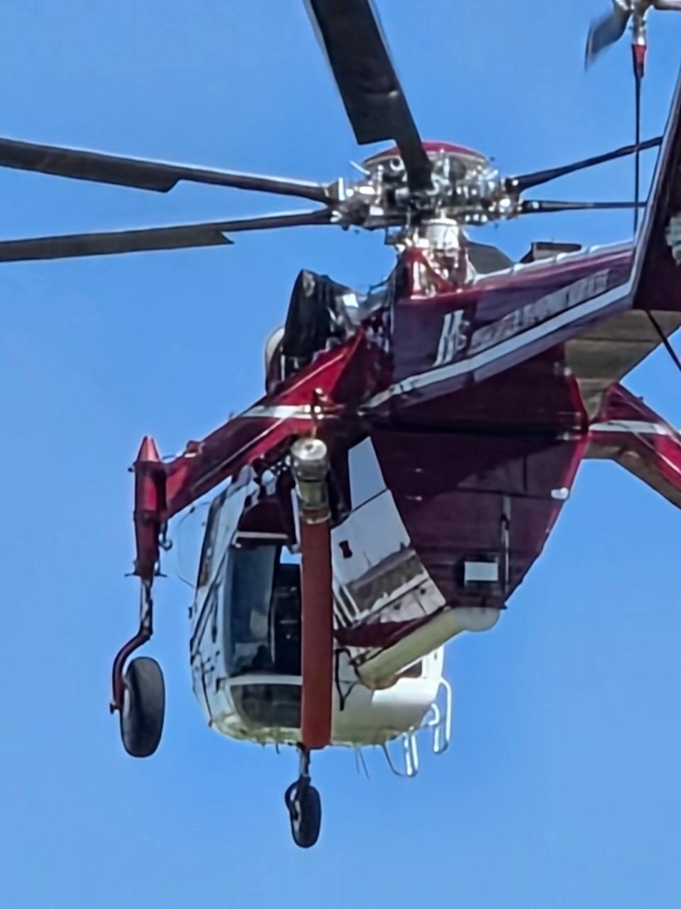 Helicopter photographed against a clear blue sky